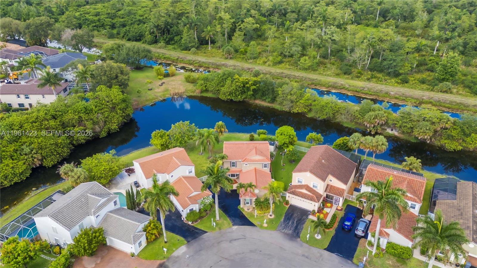 21451 Sawmill Court Boca Raton, FL 33498 - Photo 48 of 67 an aerial view of a house with a garden and lake view