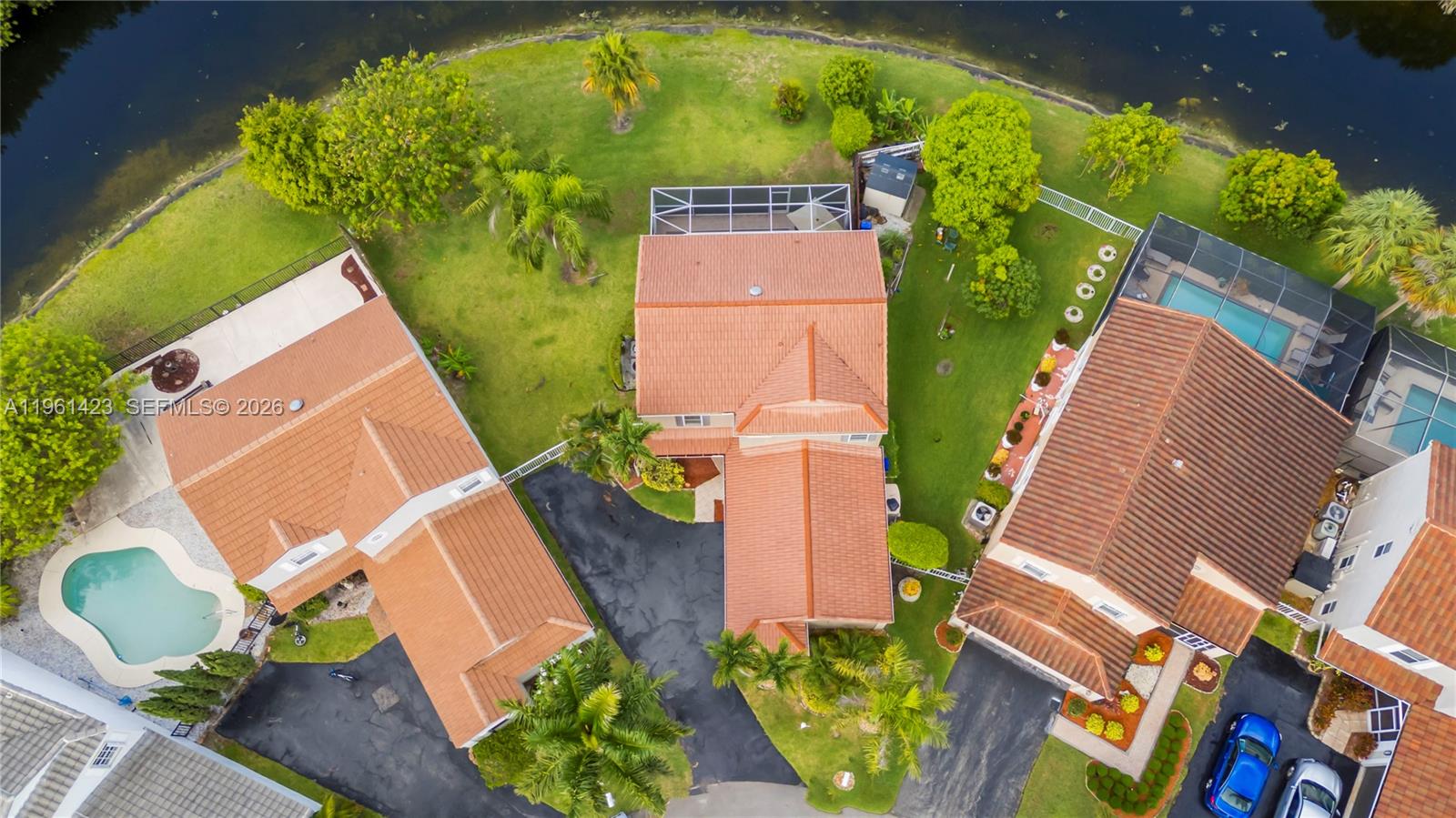 21451 Sawmill Court Boca Raton, FL 33498 - Photo 49 of 67 an aerial view of a house with a yard and garden