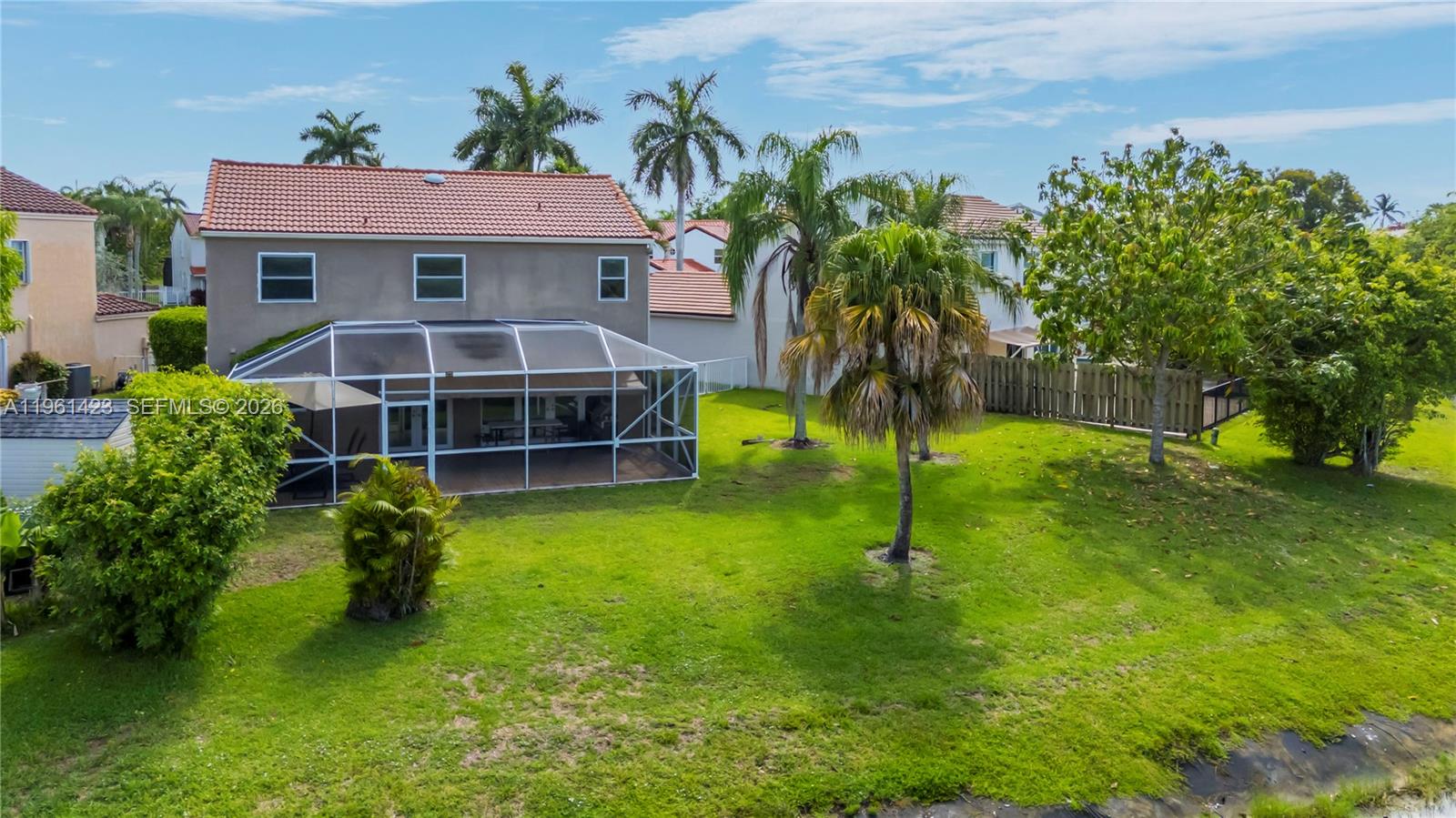 21451 Sawmill Court Boca Raton, FL 33498 - Photo 55 of 67 a house with garden in front of it