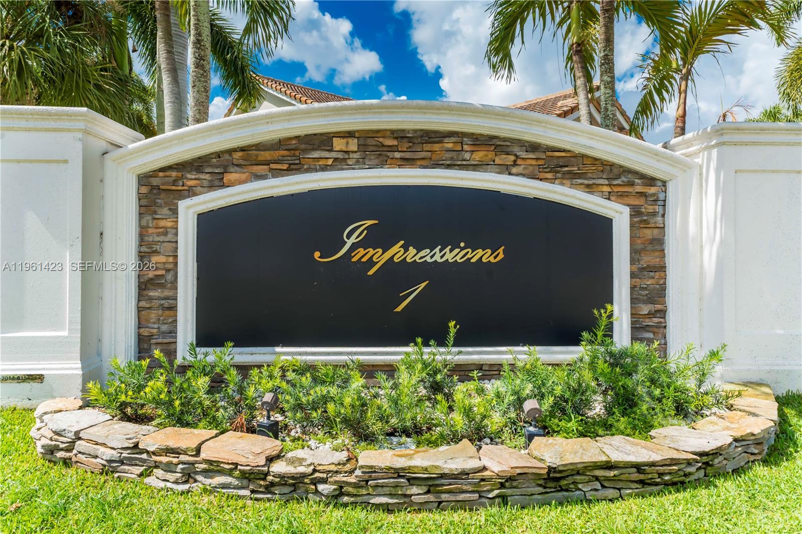 21451 Sawmill Court Boca Raton, FL 33498 - Photo 64 of 67 a sign on the side of a building