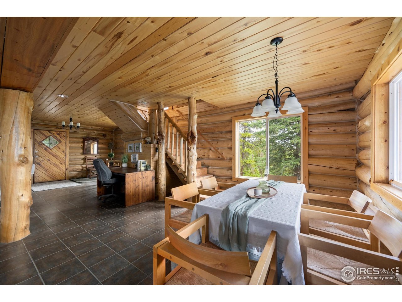 122 Elk Way Drake, CO 80515 - Photo 12 of 43 a living room with furniture and a chandelier
