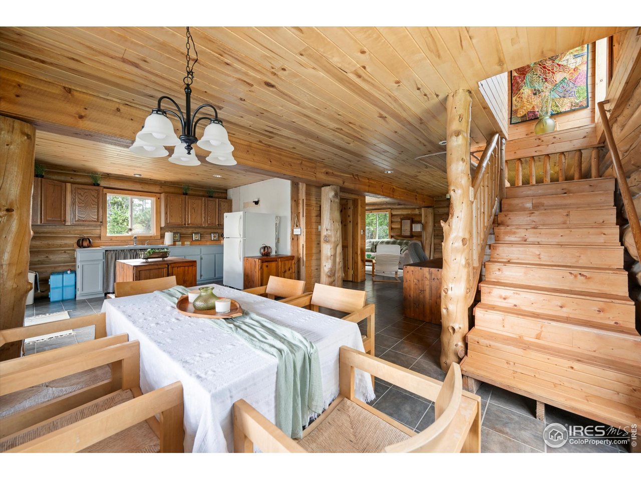 122 Elk Way Drake, CO 80515 - Photo 18 of 43 a bedroom with furniture and wooden floor