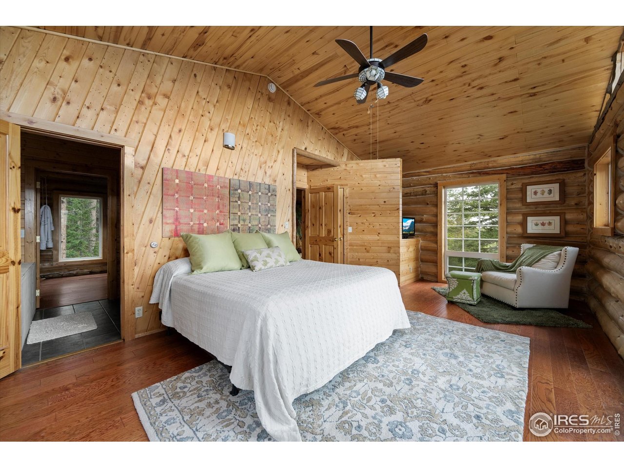 122 Elk Way Drake, CO 80515 - Photo 19 of 43 a bed room with a bed and a couch