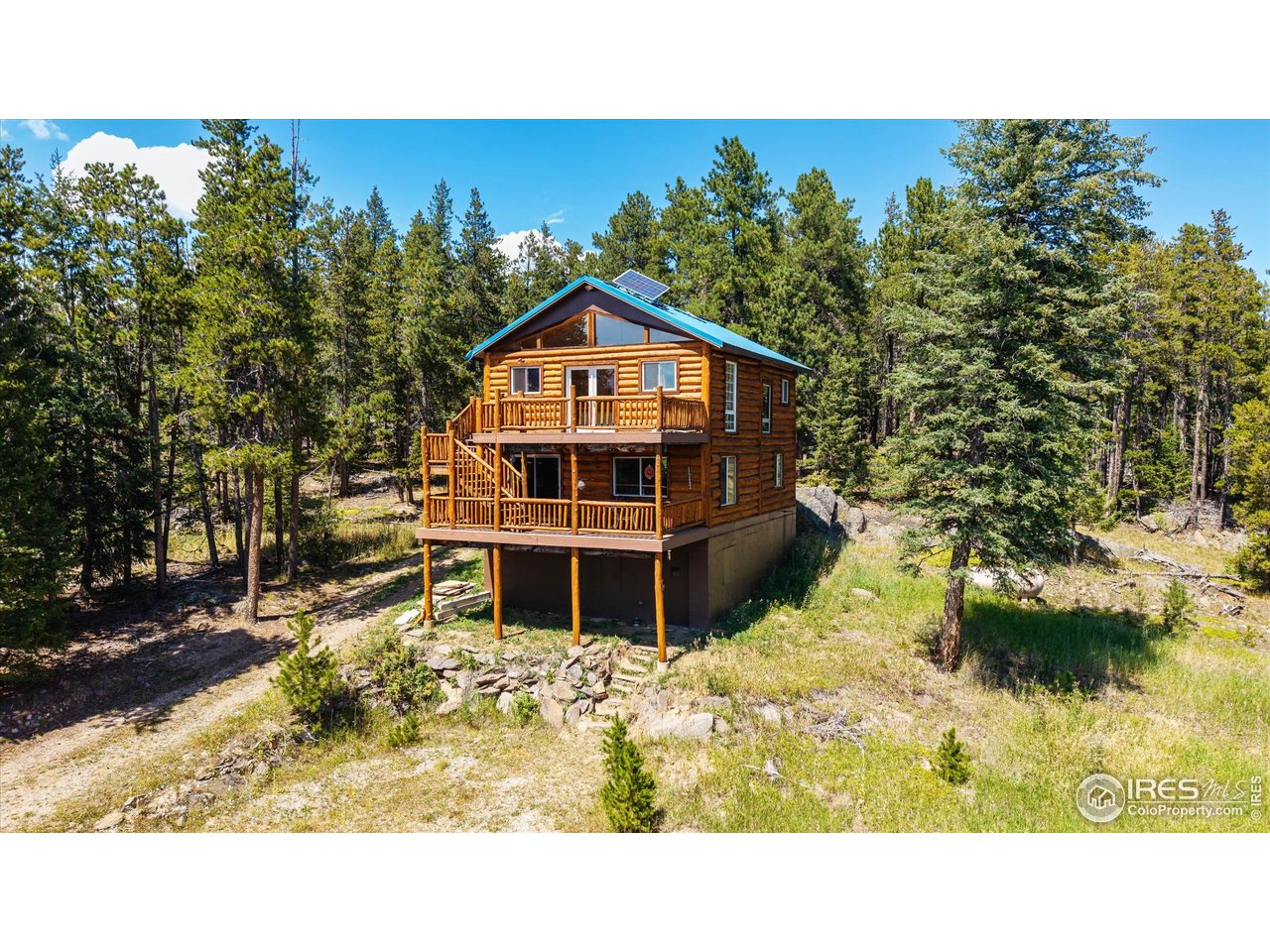 122 Elk Way Drake, CO 80515 - Photo 2 of 43 a balcony with a table and chairs