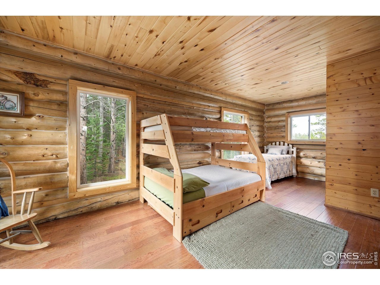 122 Elk Way Drake, CO 80515 - Photo 26 of 43 a bedroom with furniture and a window