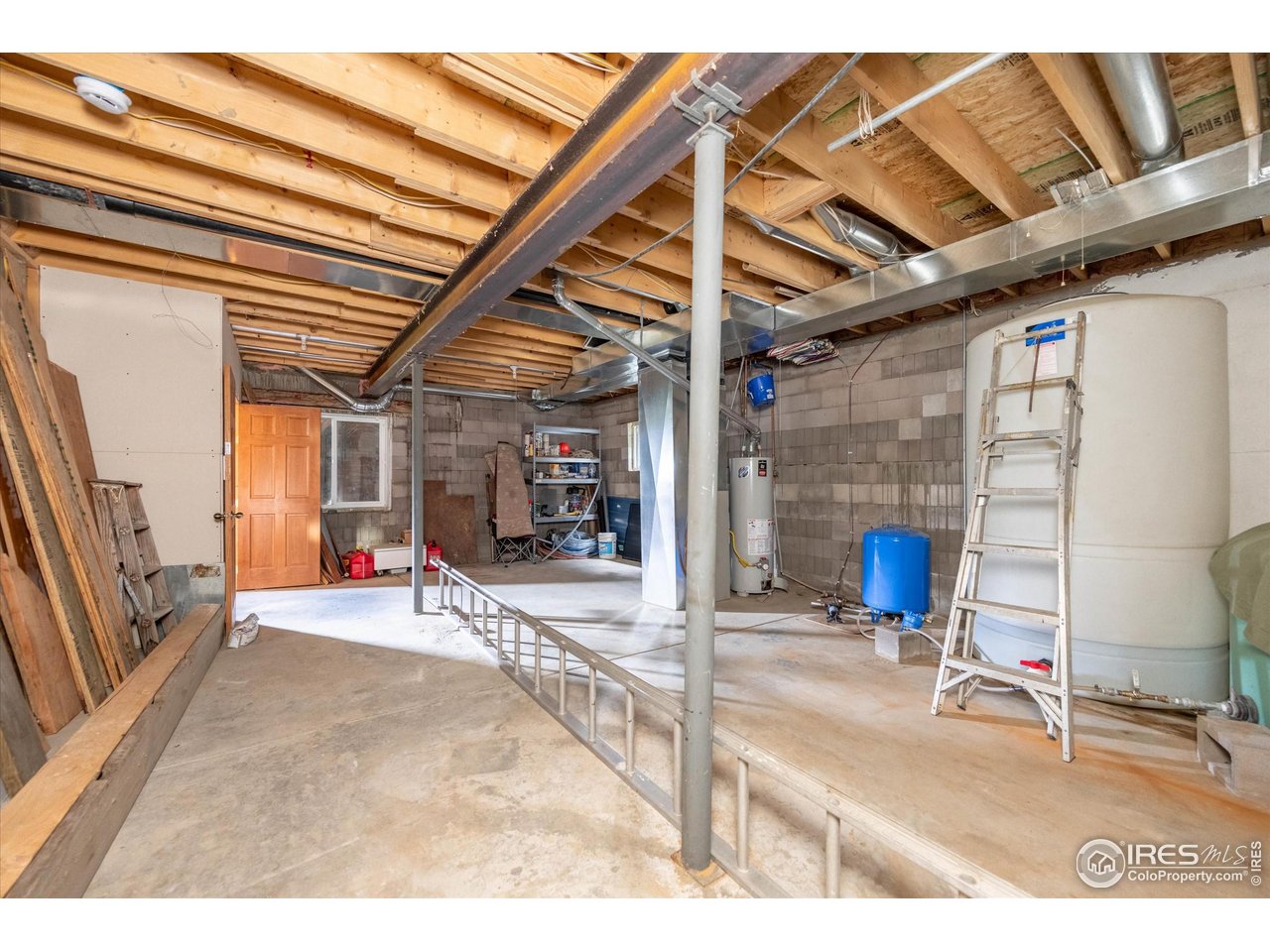122 Elk Way Drake, CO 80515 - Photo 29 of 43 a view of a room with wooden floor and windows