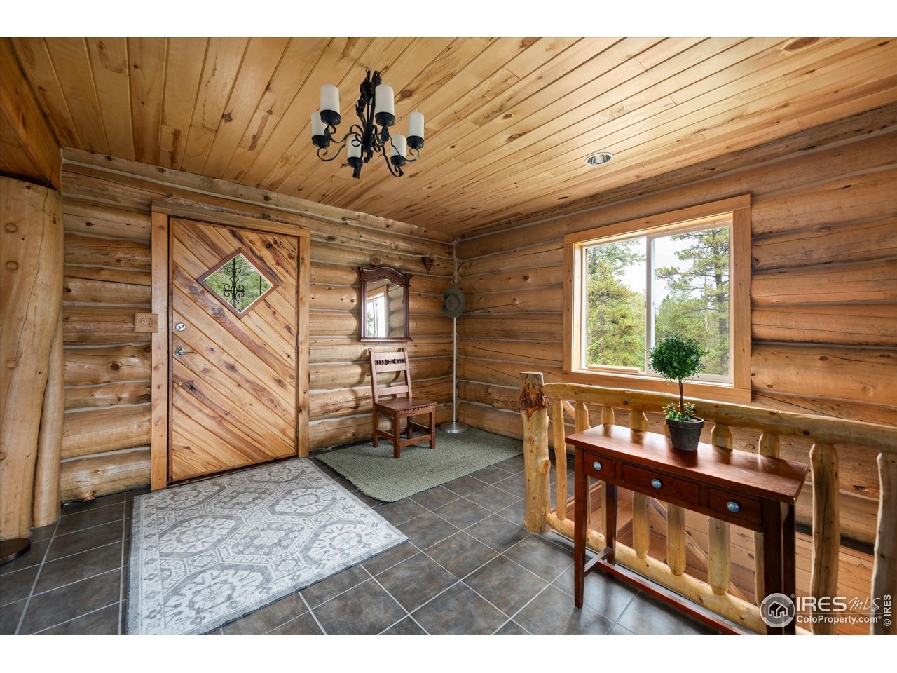 122 Elk Way Drake, CO 80515 - Photo 6 of 43 a view of a porch with furniture