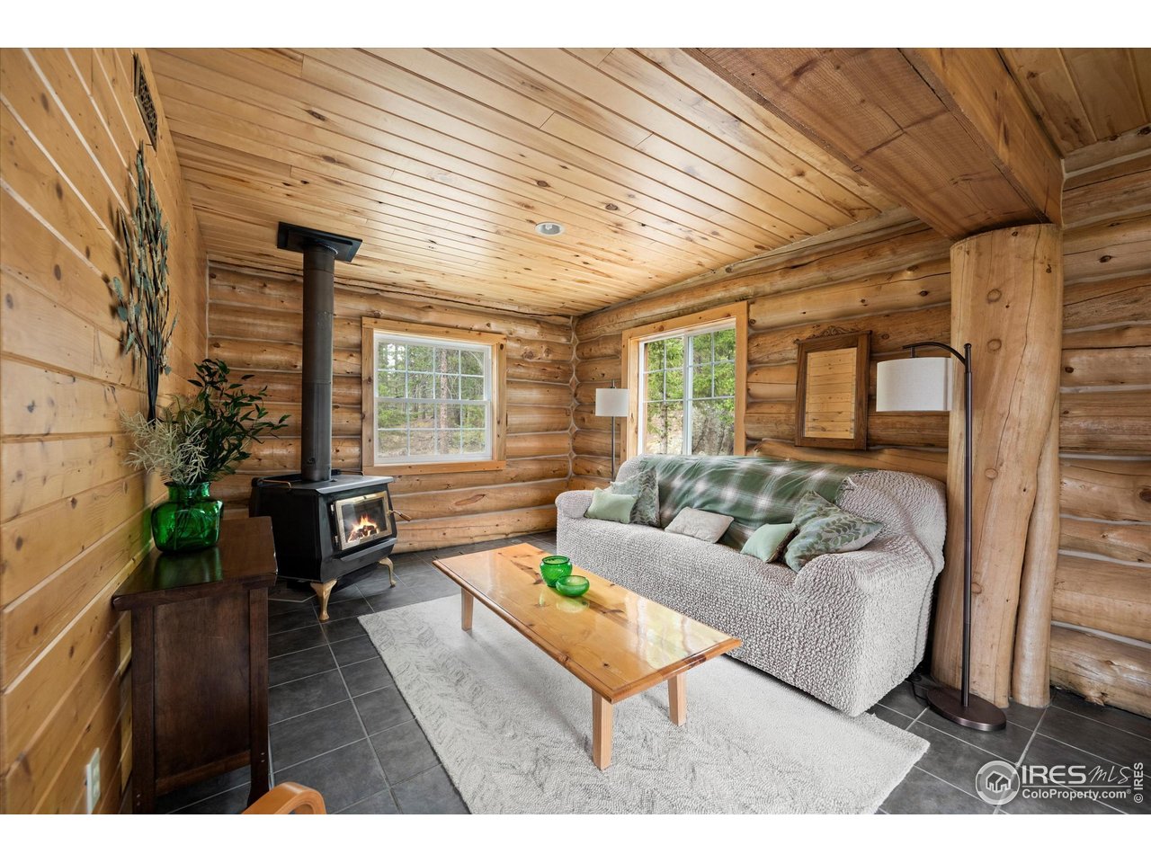 122 Elk Way Drake, CO 80515 - Photo 7 of 43 a living room with furniture and a wooden floor