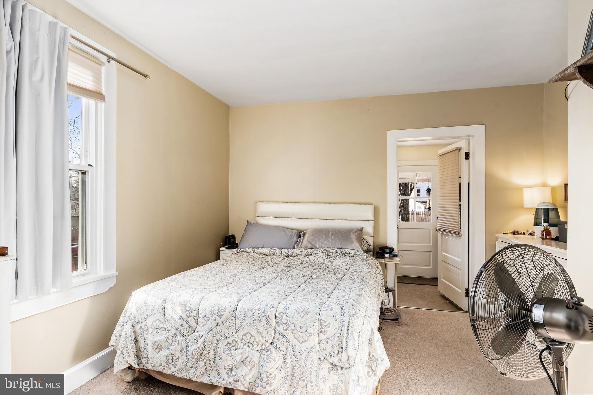 116 Potter Street Haddonfield, NJ 08033 - Photo 14 of 29 a bedroom with a bed and a mirror