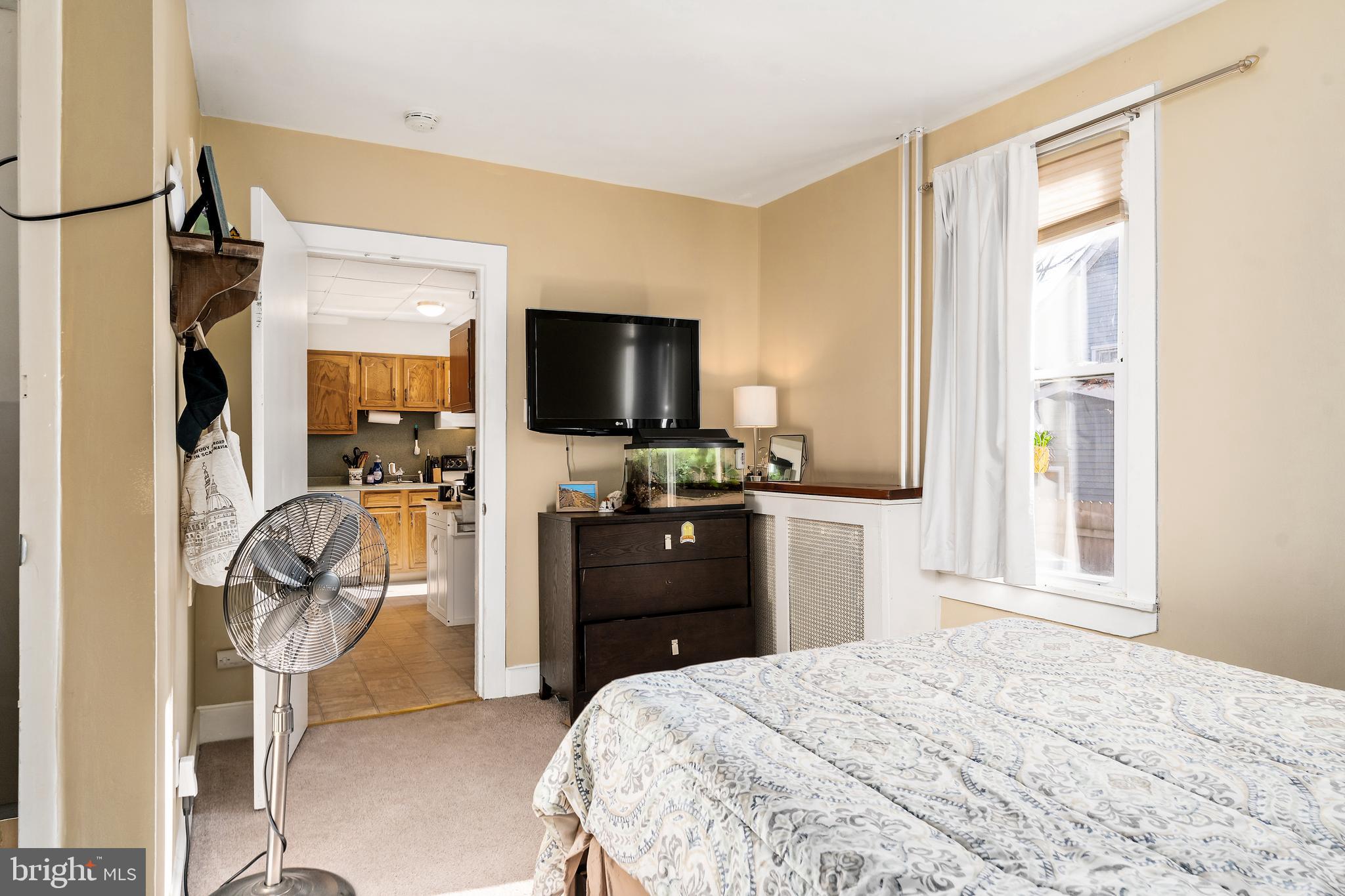116 Potter Street Haddonfield, NJ 08033 - Photo 16 of 29 a bedroom with a bed and a flat tv screen on the dresser