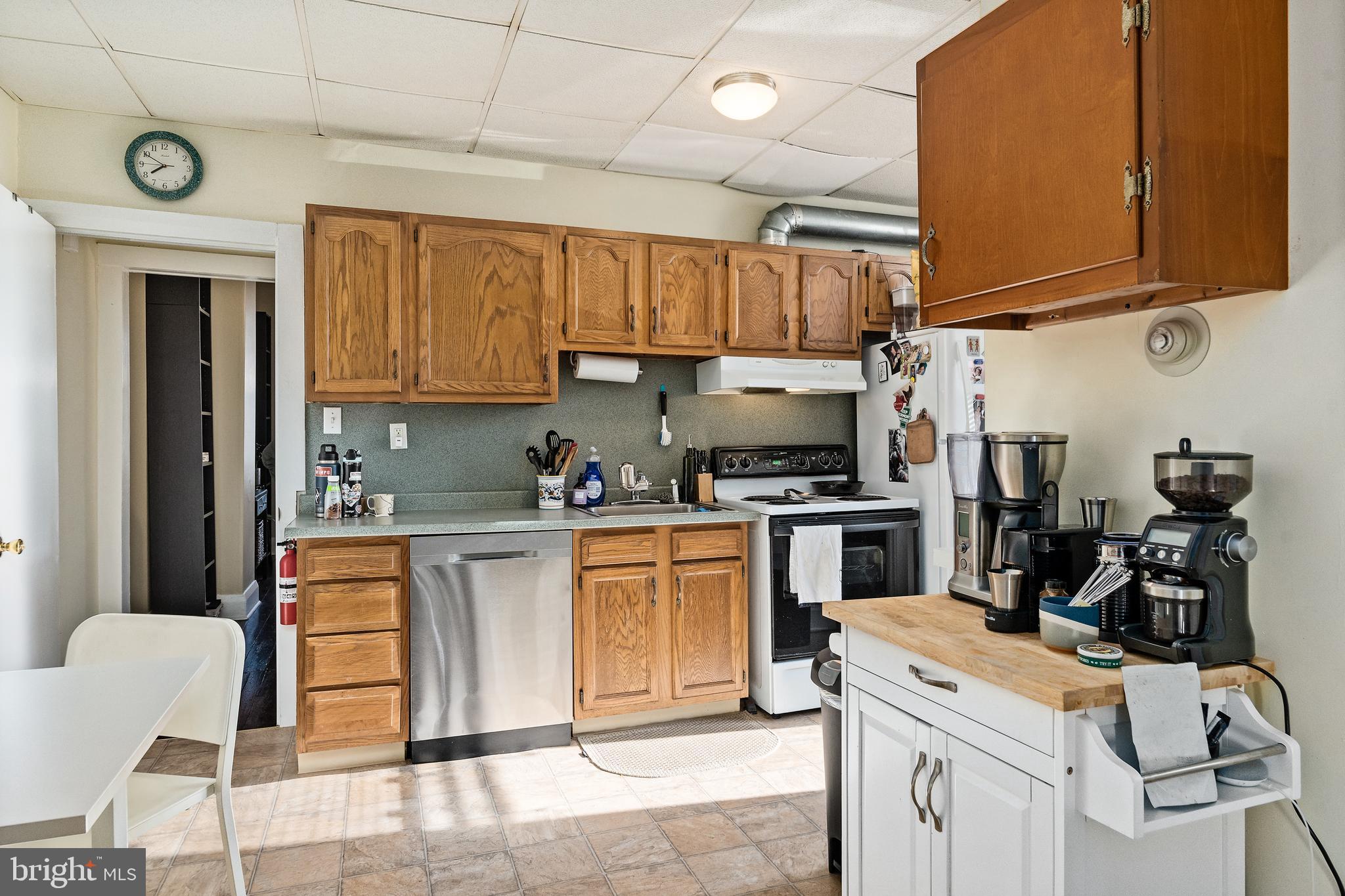 116 Potter Street Haddonfield, NJ 08033 - Photo 20 of 29 a kitchen with stainless steel appliances granite countertop a stove sink and cabinets