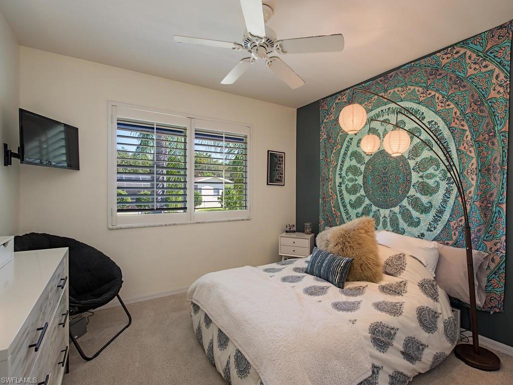 5138 Starfish Avenue Naples, FL 34103 - Photo 11 of 17 a bedroom with a bed and a window