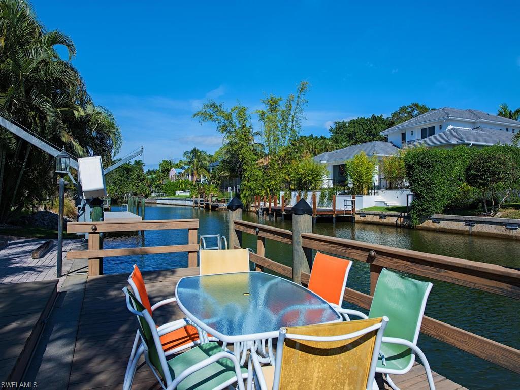 5138 Starfish Avenue Naples, FL 34103 - Photo 12 of 17 a outdoor view with a sitting space
