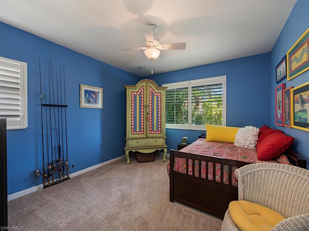 5138 Starfish Avenue Naples, FL 34103 - Photo 10 of 17 a bedroom with furniture and a window