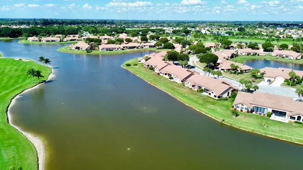 an aerial view of a house with a lake view