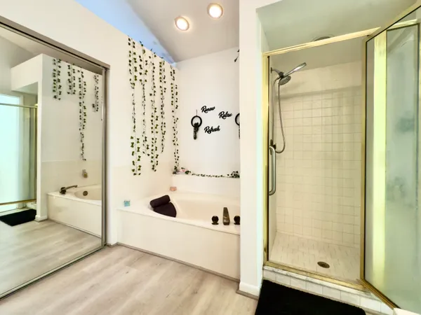 a bathroom with a shower and a tub