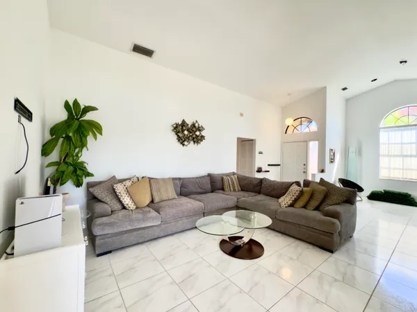 a living room with furniture and a couch