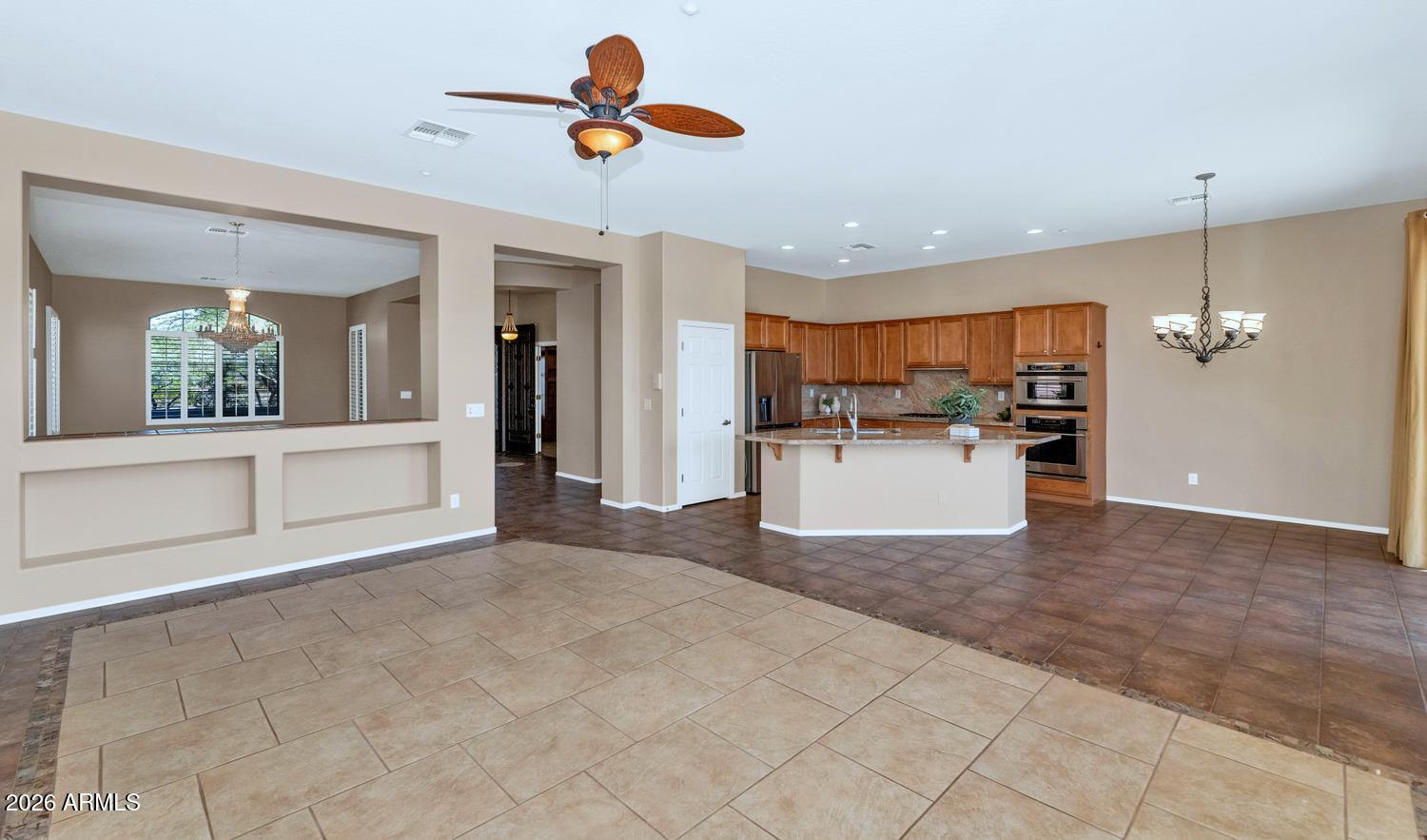 41123 North River Bend Road Phoenix, AZ 85086 - Photo 13 of 45 a view of a kitchen with a refrigerator a microwave oven a sink and a refrigerator