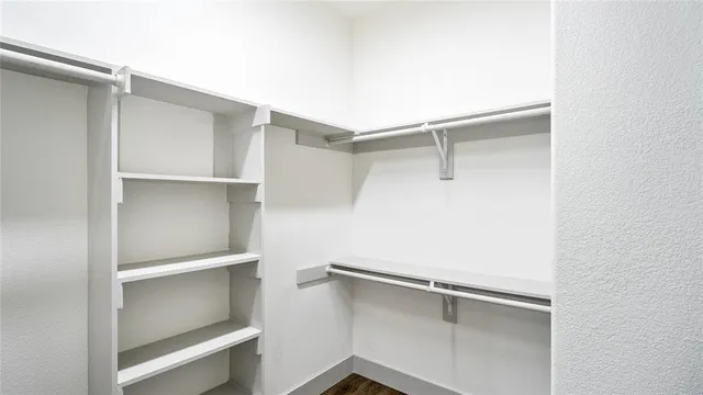 a view of an empty walk in closet