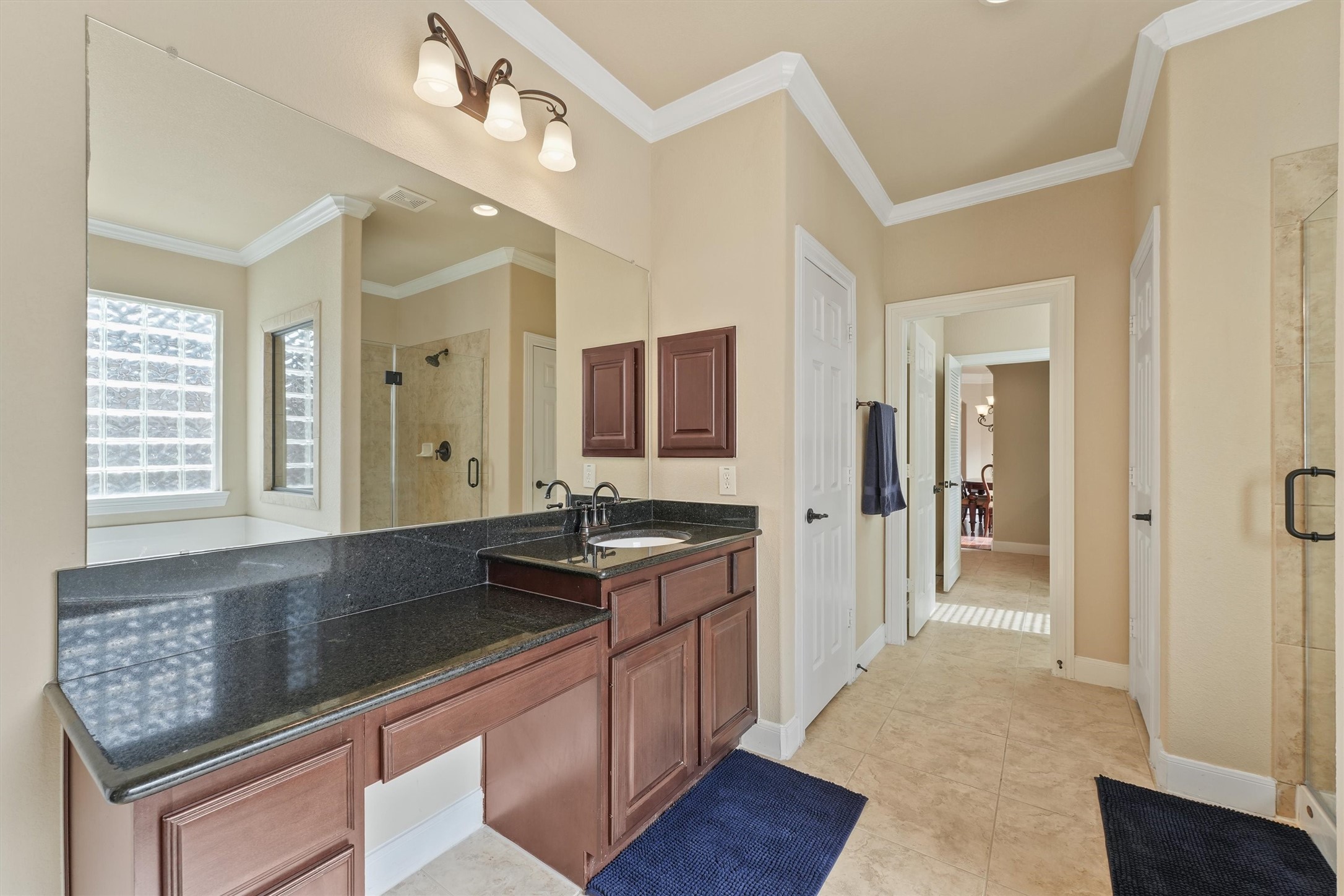 15702 Bellforest Court Houston, TX 77044 - Photo 17 of 38 a kitchen with granite countertop a sink and cabinets