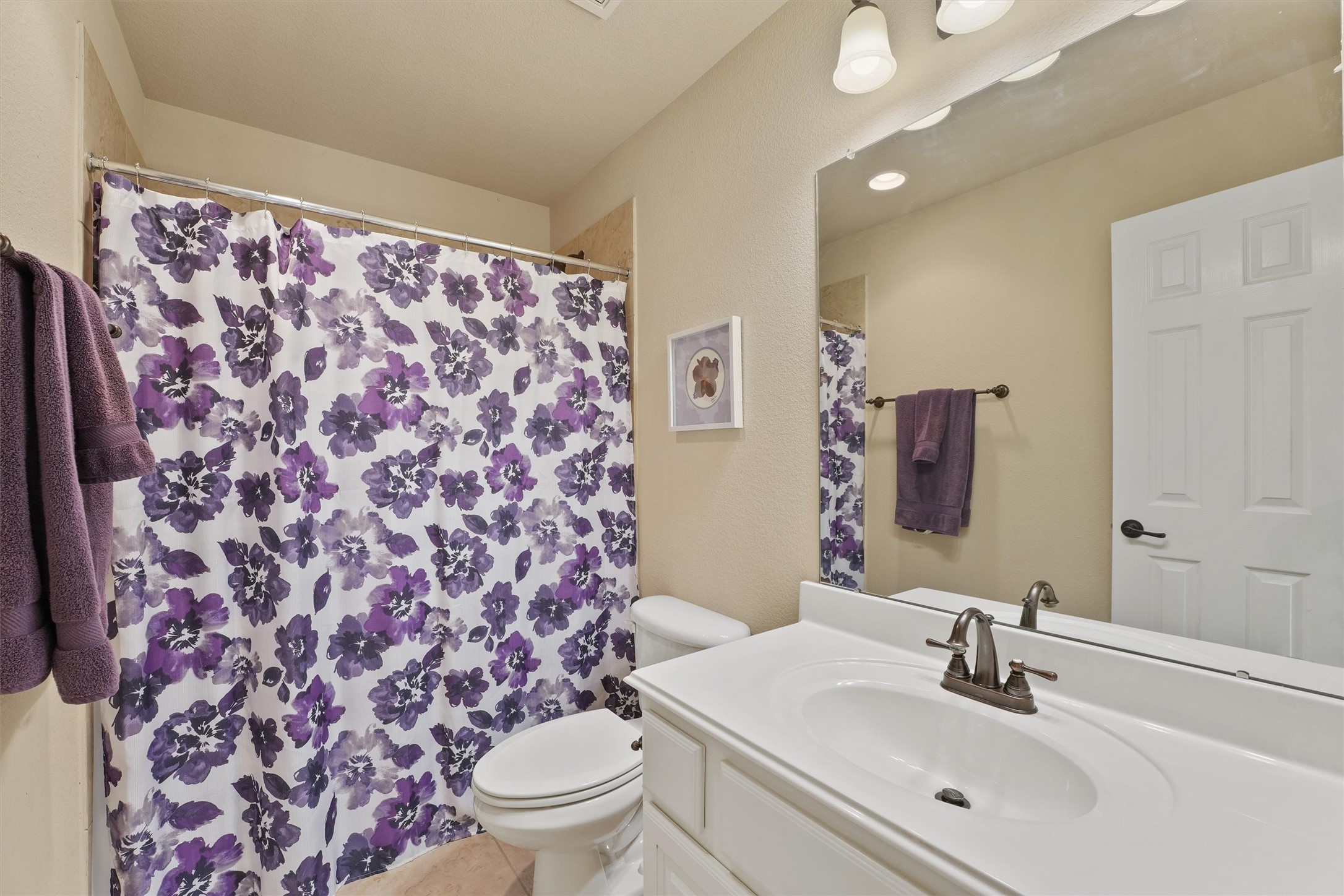 15702 Bellforest Court Houston, TX 77044 - Photo 26 of 38 a bathroom with a sink toilet and shower