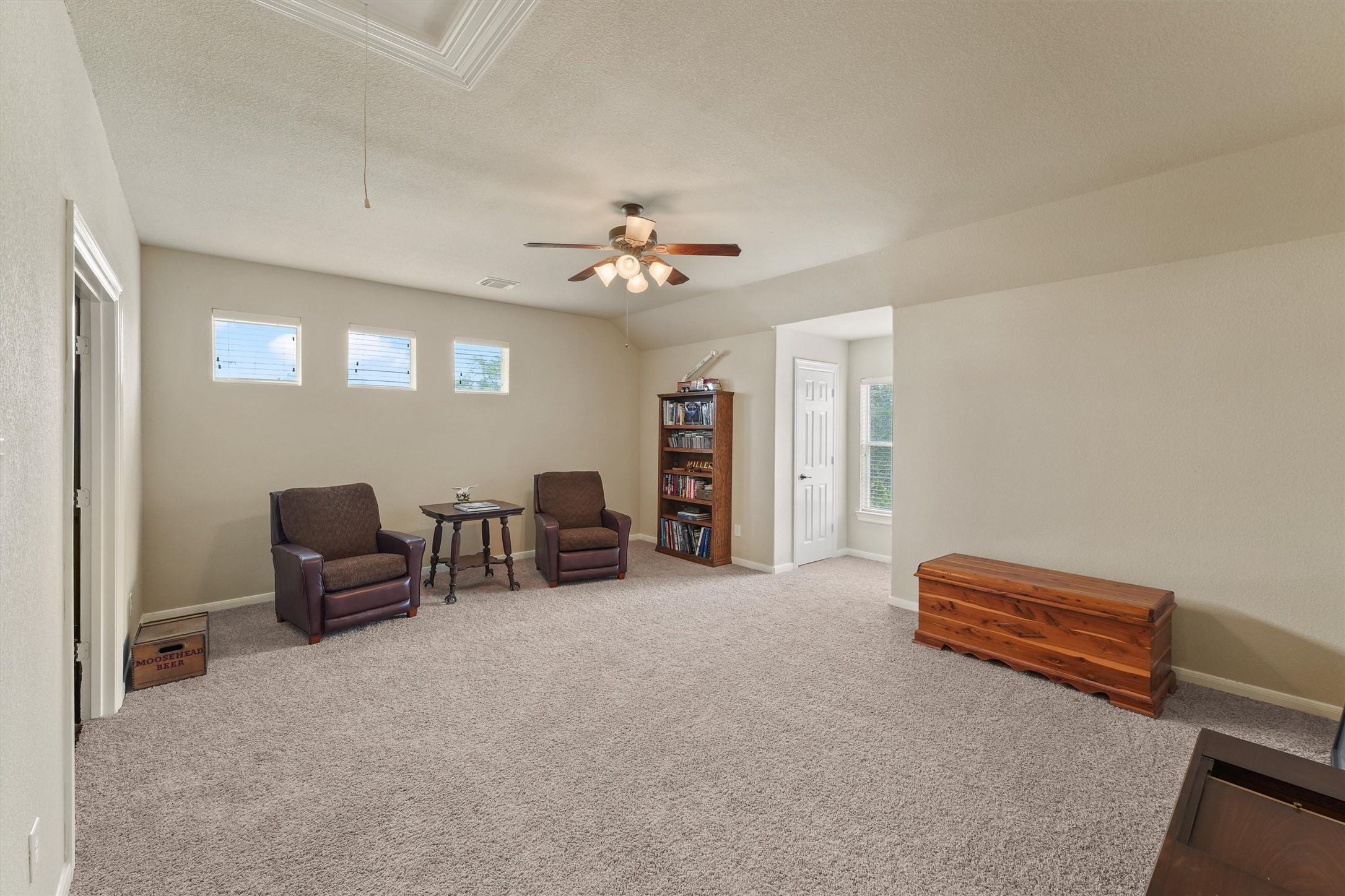 15702 Bellforest Court Houston, TX 77044 - Photo 29 of 38 a living room with furniture and a ceiling fan