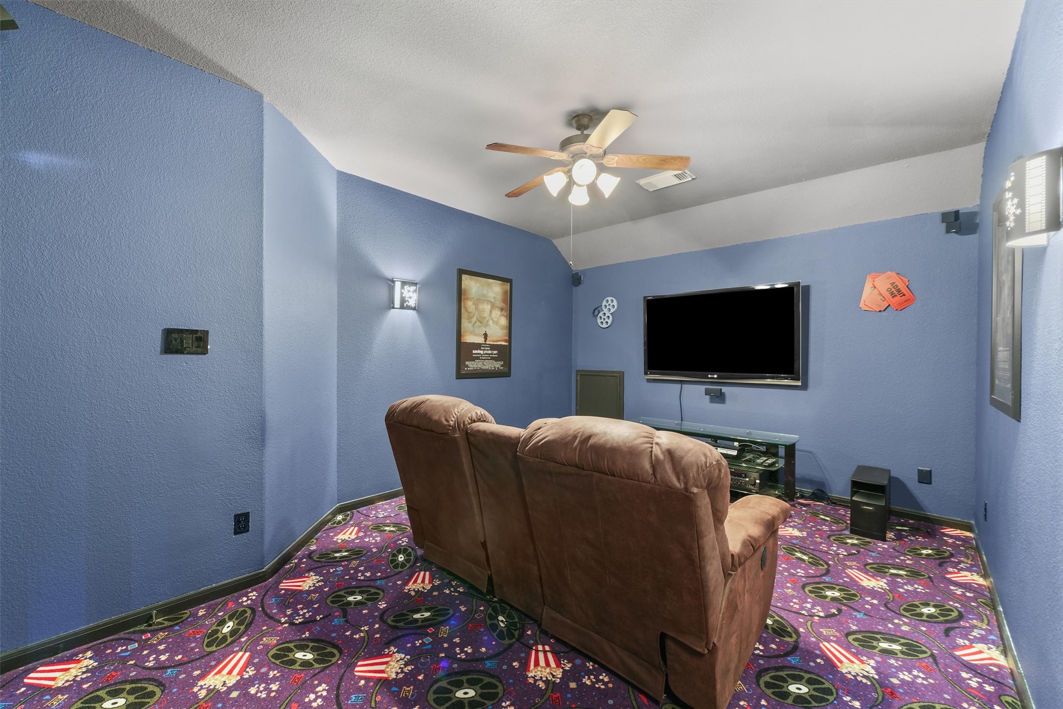 15702 Bellforest Court Houston, TX 77044 - Photo 30 of 38 a living room with furniture and a flat screen tv