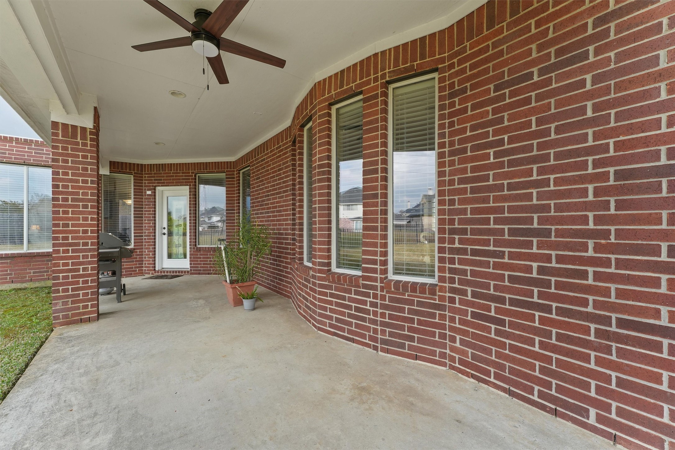 15702 Bellforest Court Houston, TX 77044 - Photo 32 of 38 a view of a brick house with a ceiling fan