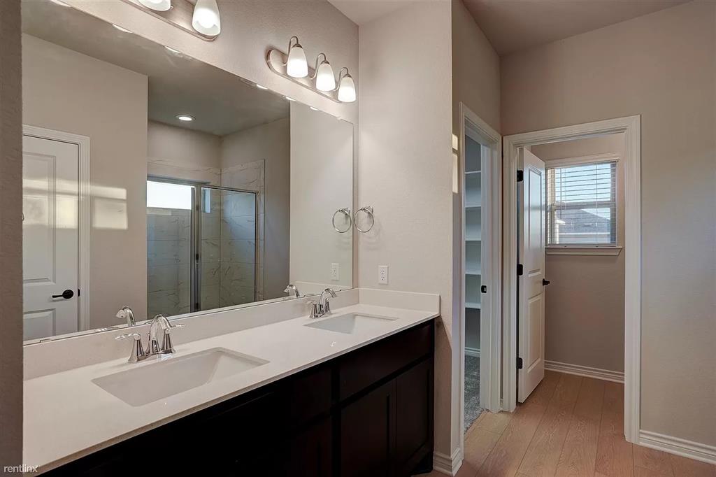 1809 Turtle Bay Loop Leander, TX 78641 - Photo 13 of 30 Primary bathroom with double vanity