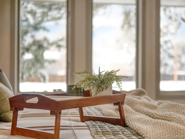a living room with a couch and a view of outdoor space