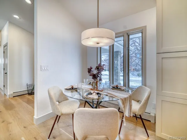 a view of a dining room with furniture window and outside view