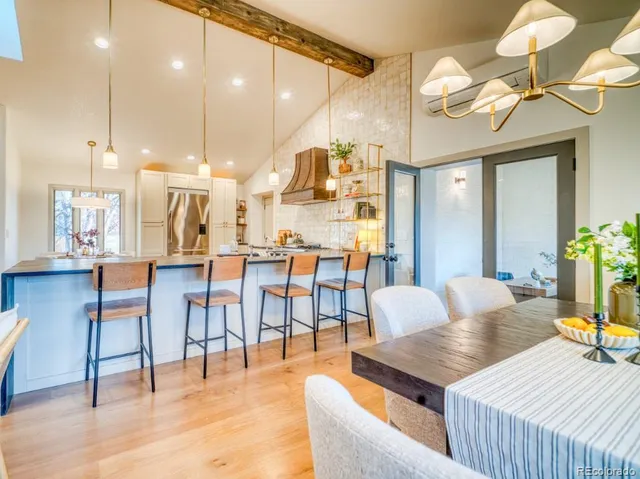 a living room with lots of furniture and a dining table