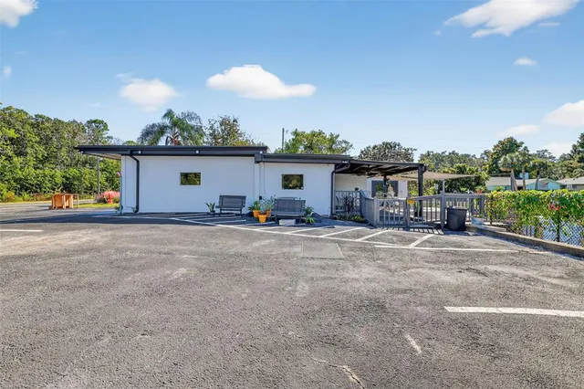 an aerial view of a houses with a swimming pool