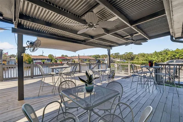 a view of a swimming pool with outdoor seating