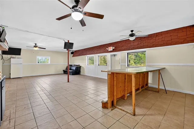 a kitchen with stainless steel appliances granite countertop a sink and a refrigerator