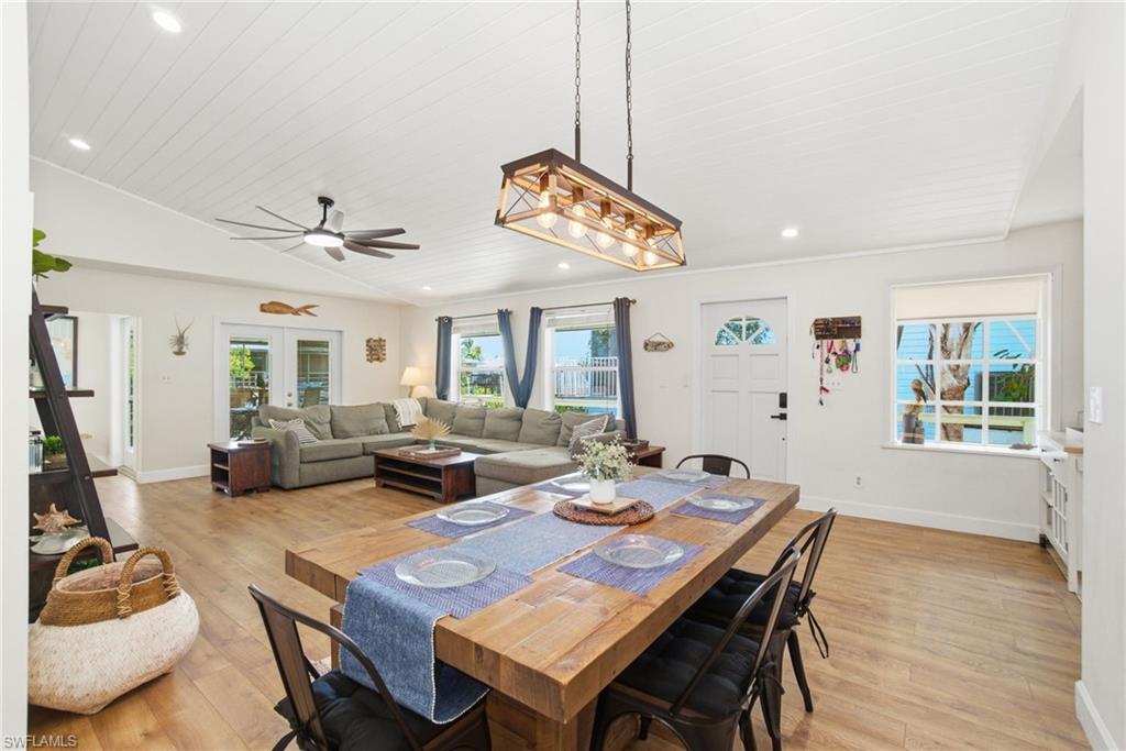 1286 Venetian Way Naples, FL 34110 - Photo 5 of 46 a view of a dining room with furniture window and wooden floor
