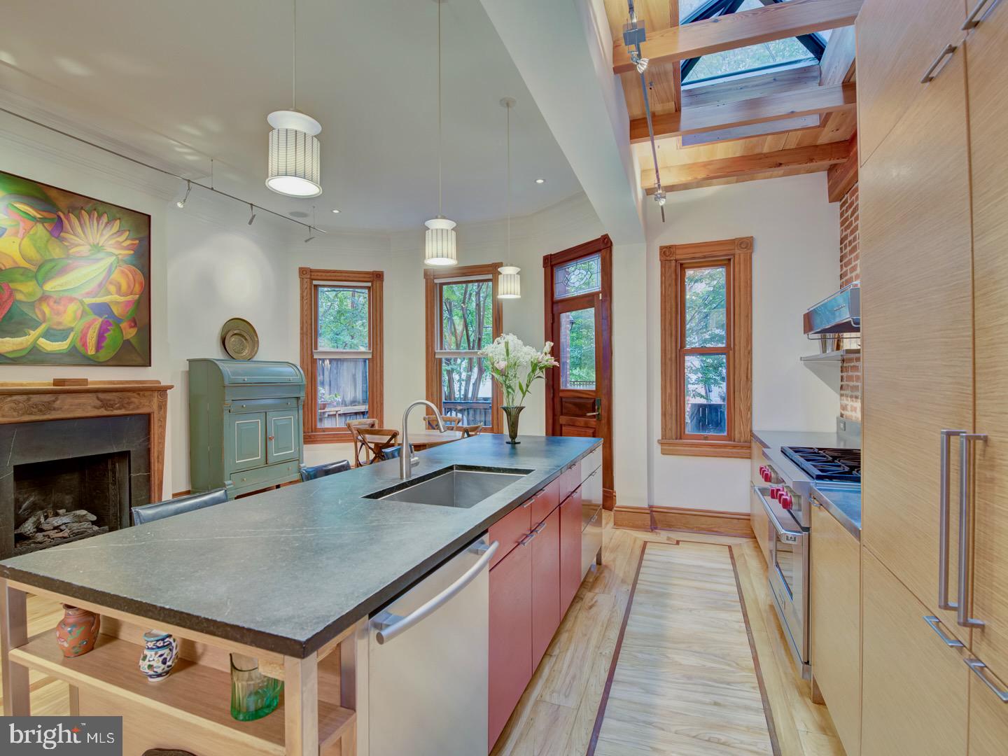 1705 Q Street Northwest Washington, DC 20009 - Photo 21 of 87 a dining hall with stainless steel appliances granite countertop a stove and a refrigerator