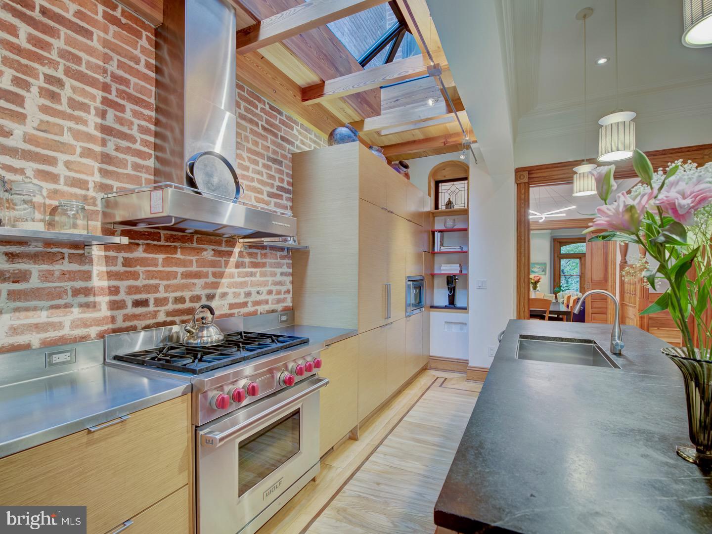 1705 Q Street Northwest Washington, DC 20009 - Photo 25 of 87 a kitchen with a stove and a white cabinets