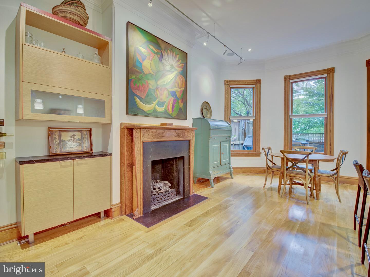 1705 Q Street Northwest Washington, DC 20009 - Photo 29 of 87 a living room with furniture and a fireplace