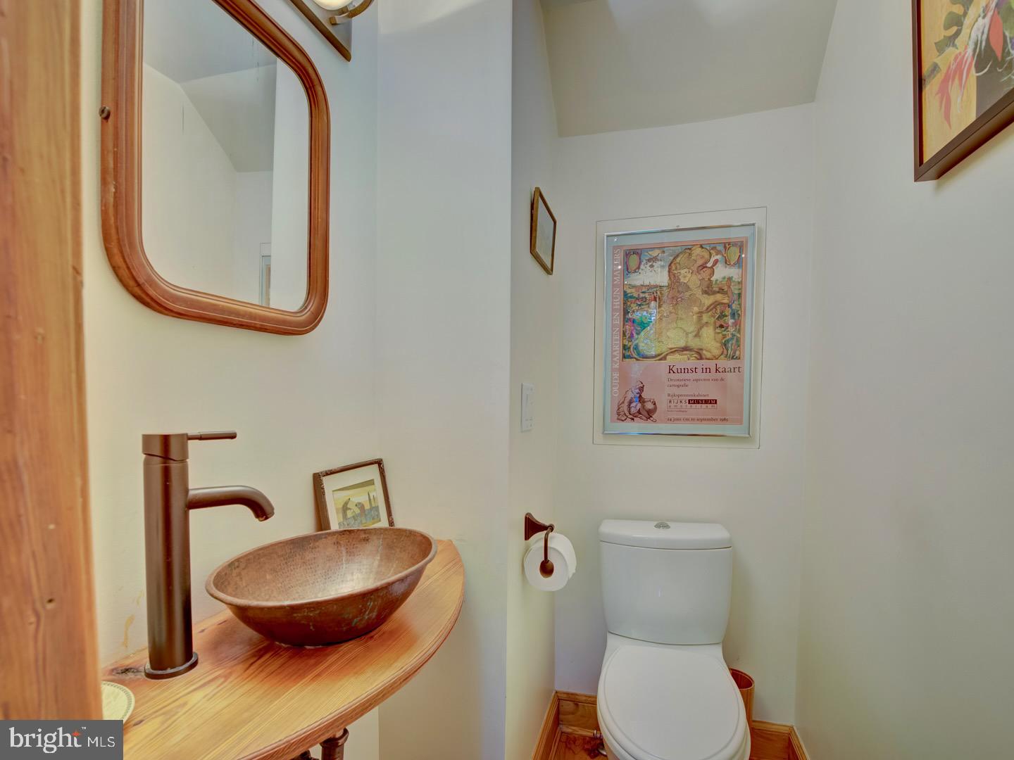 1705 Q Street Northwest Washington, DC 20009 - Photo 30 of 87 a bathroom with a toilet a sink and a mirror
