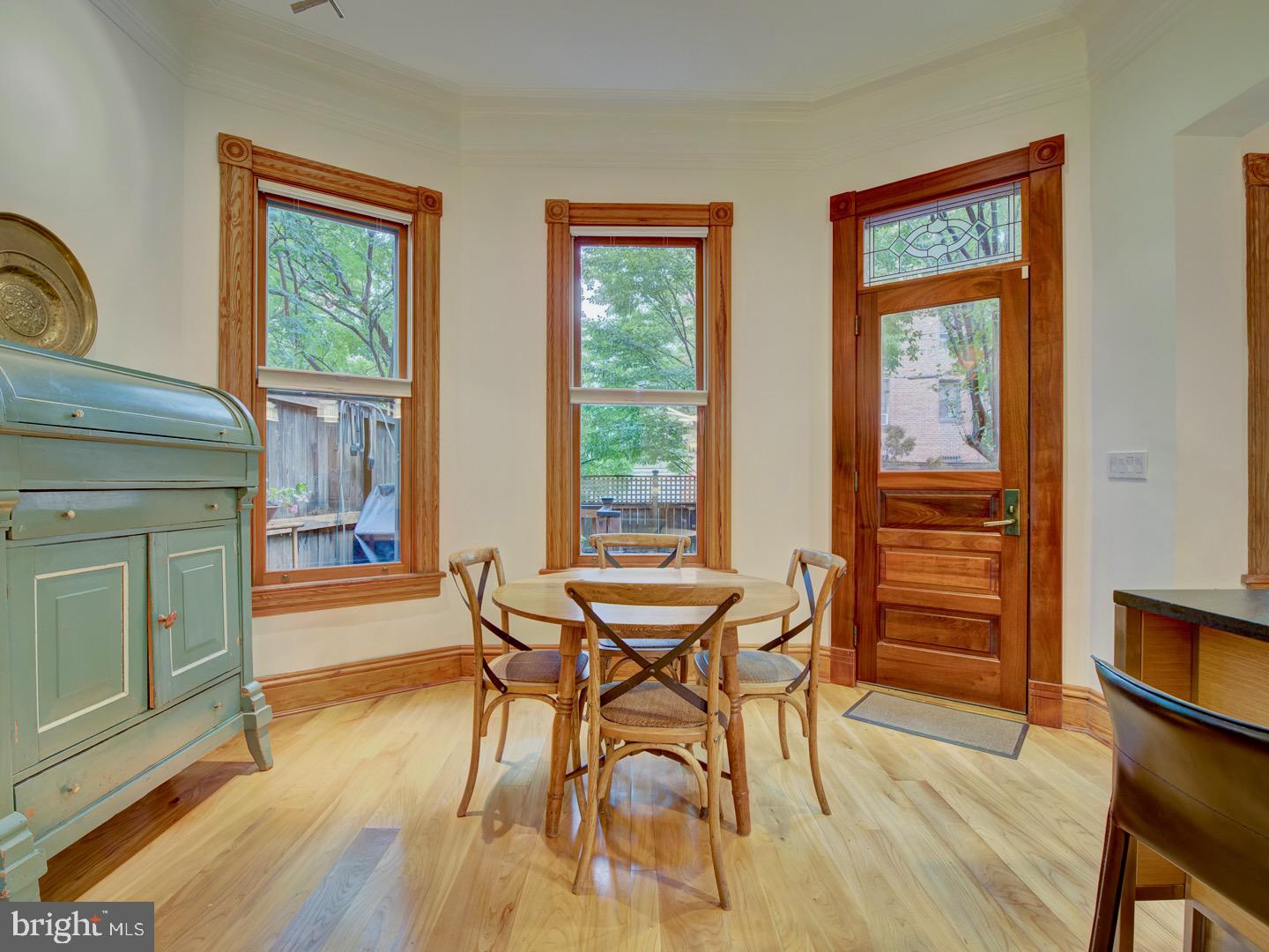 1705 Q Street Northwest Washington, DC 20009 - Photo 31 of 87 a view of a dining room with furniture window and wooden floor