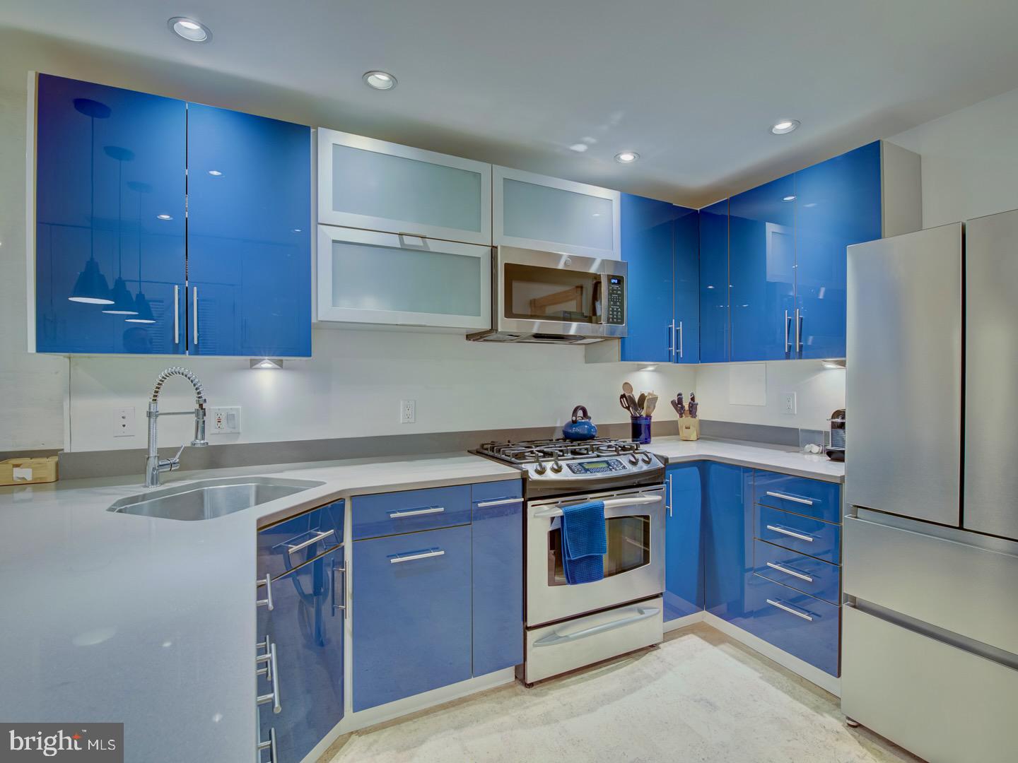 1705 Q Street Northwest Washington, DC 20009 - Photo 73 of 87 a kitchen with stainless steel appliances granite countertop a stove a sink dishwasher and a refrigerator with wooden cabinets