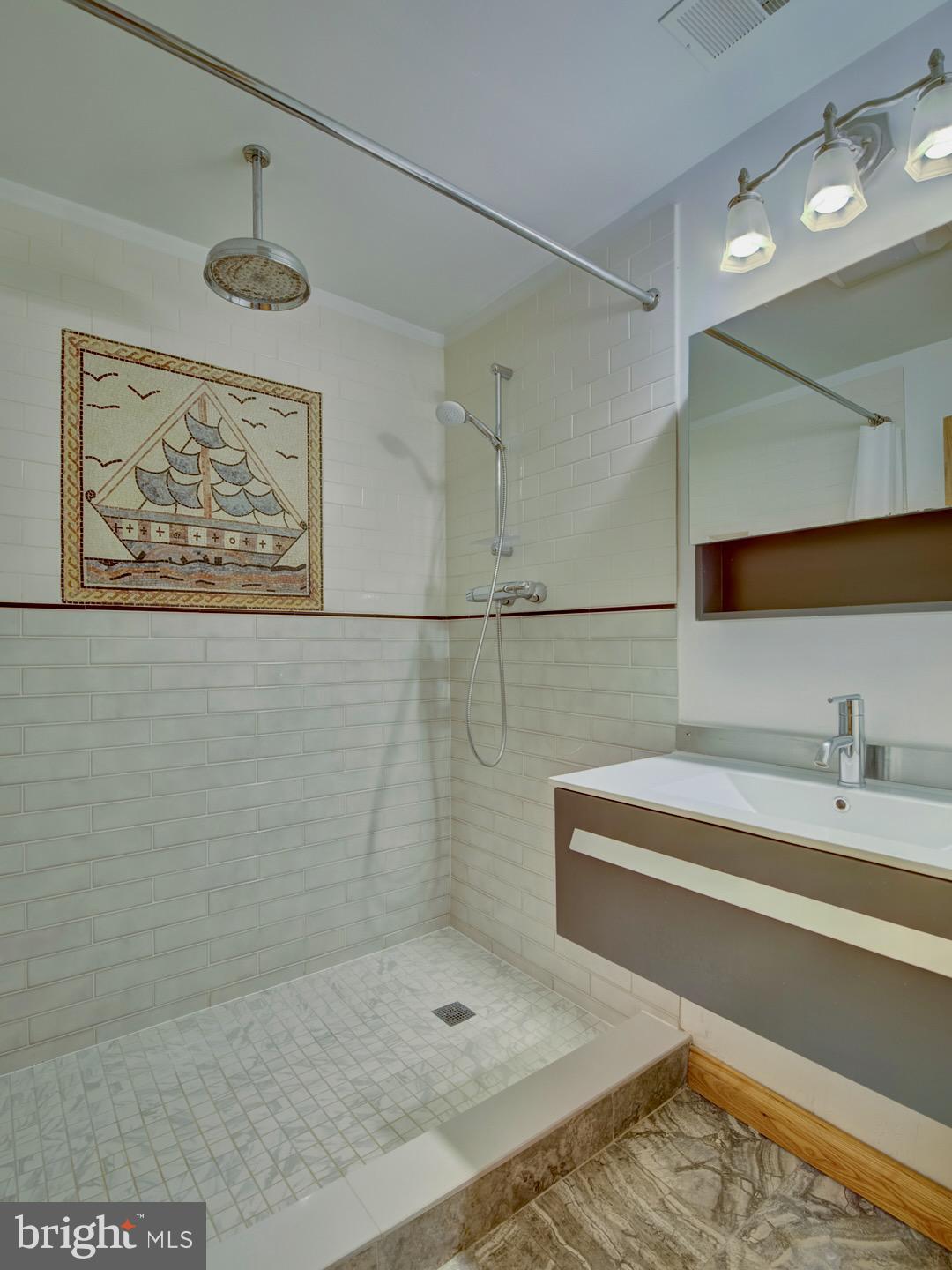 1705 Q Street Northwest Washington, DC 20009 - Photo 78 of 87 a bathroom with a shower and a sink