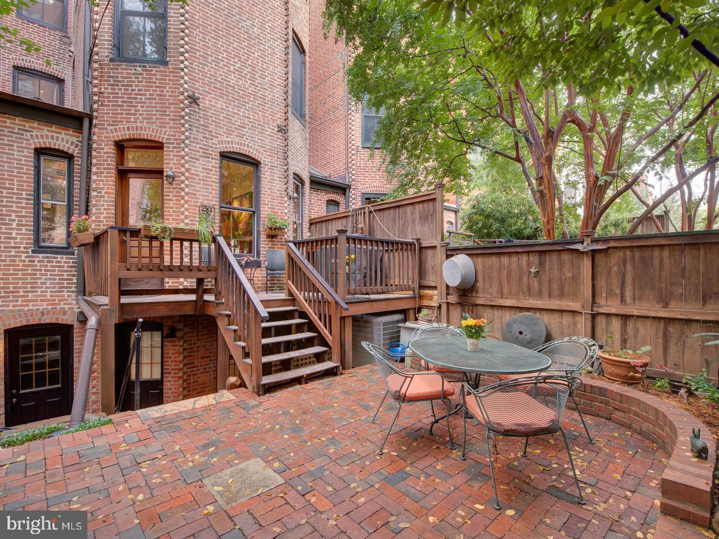 1705 Q Street Northwest Washington, DC 20009 - Photo 86 of 87 a backyard of a house with barbeque oven and outdoor seating