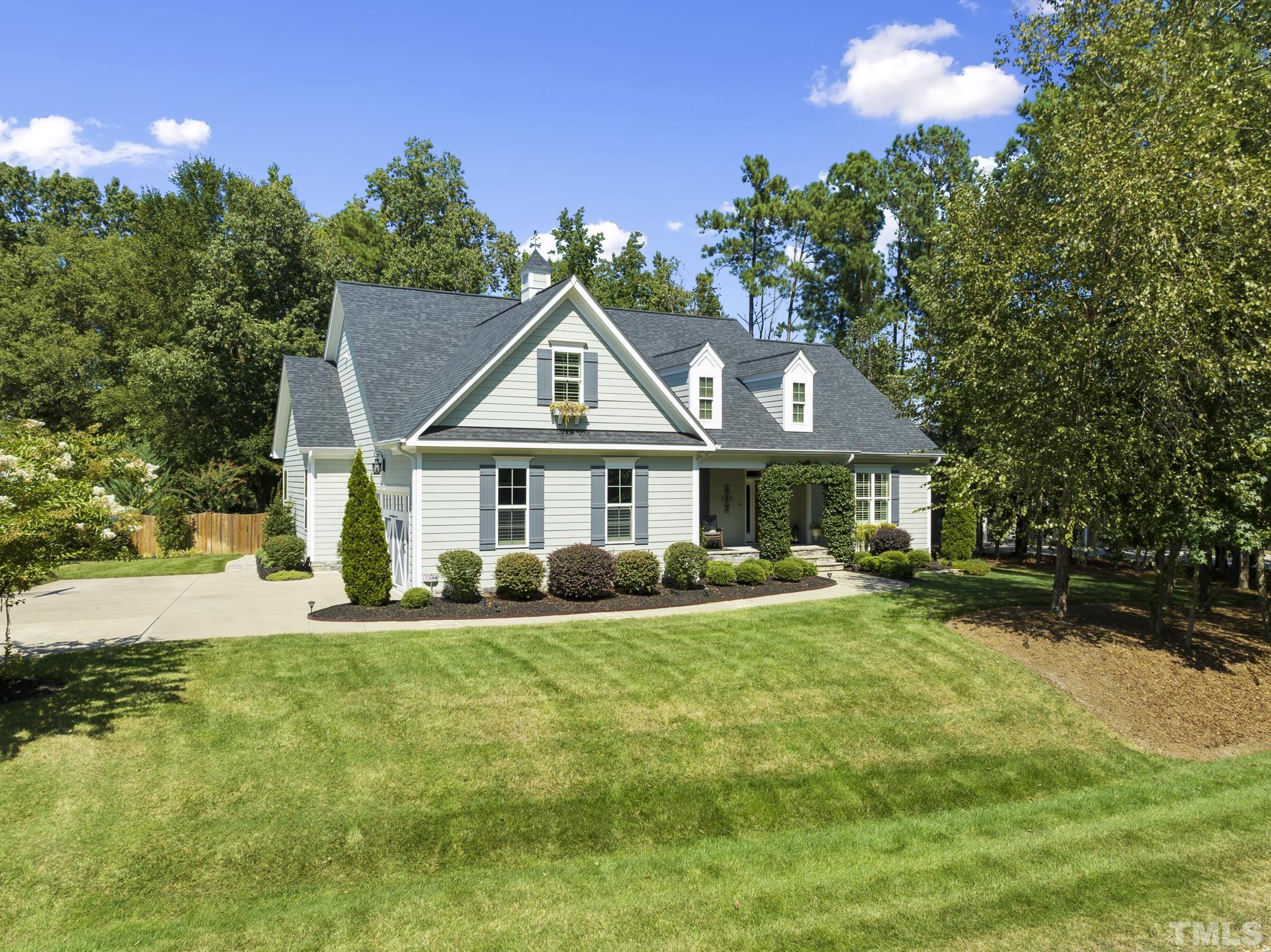 6121 Spring Branch Circle Raleigh, NC 27603 - Photo 1 of 60 a front view of a house with a garden