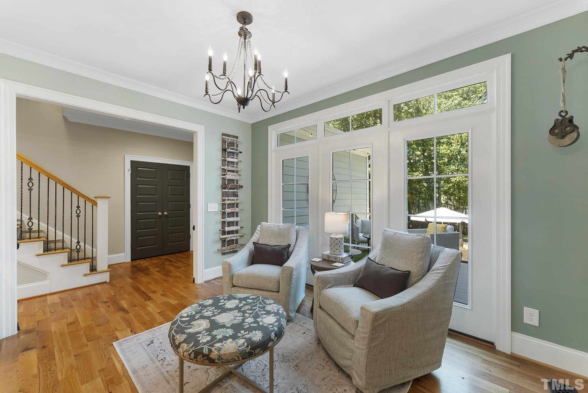 6121 Spring Branch Circle Raleigh, NC 27603 - Photo 12 of 60 a living room with furniture and a chandelier
