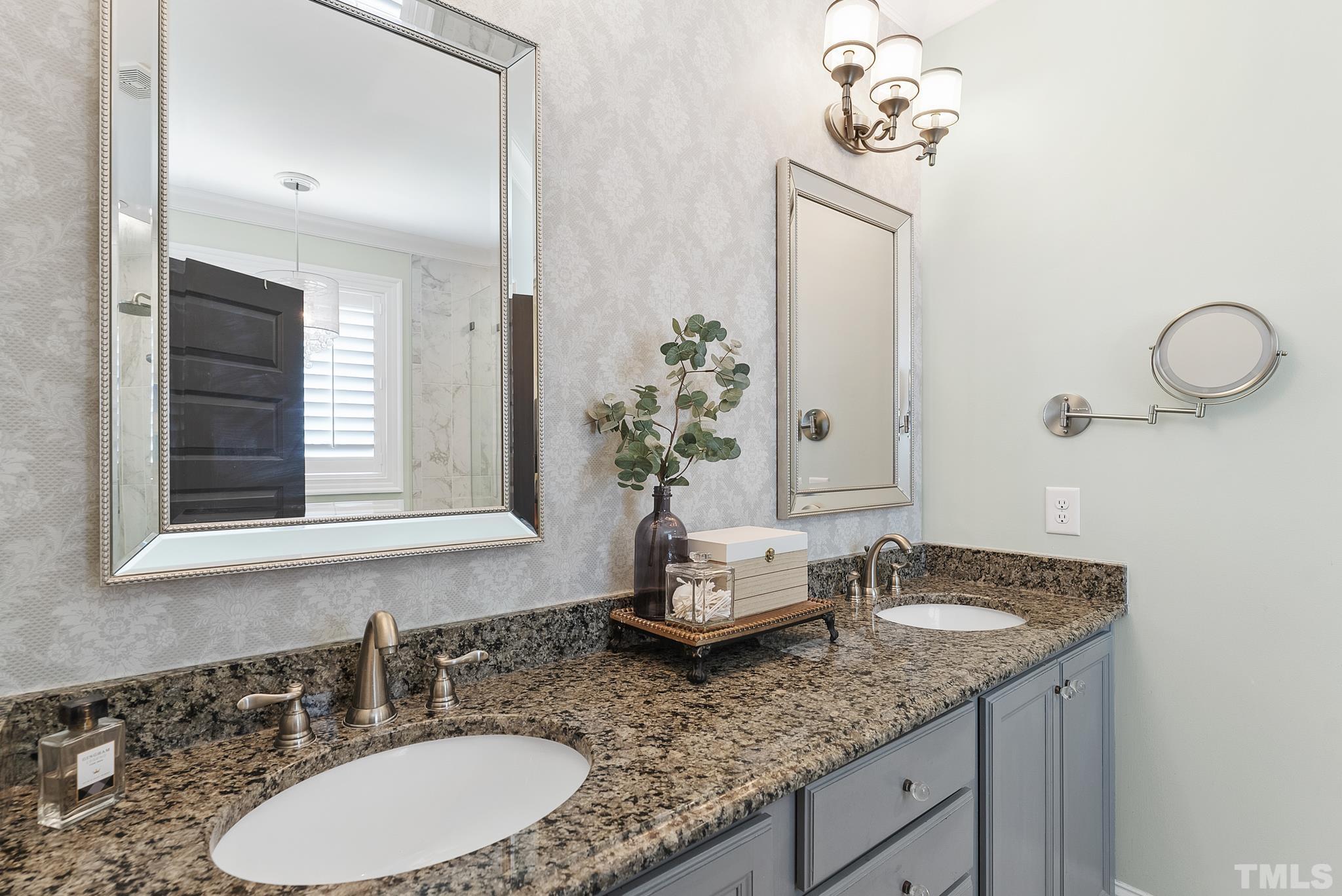 6121 Spring Branch Circle Raleigh, NC 27603 - Photo 18 of 60 a bathroom with a granite countertop sink and a mirror