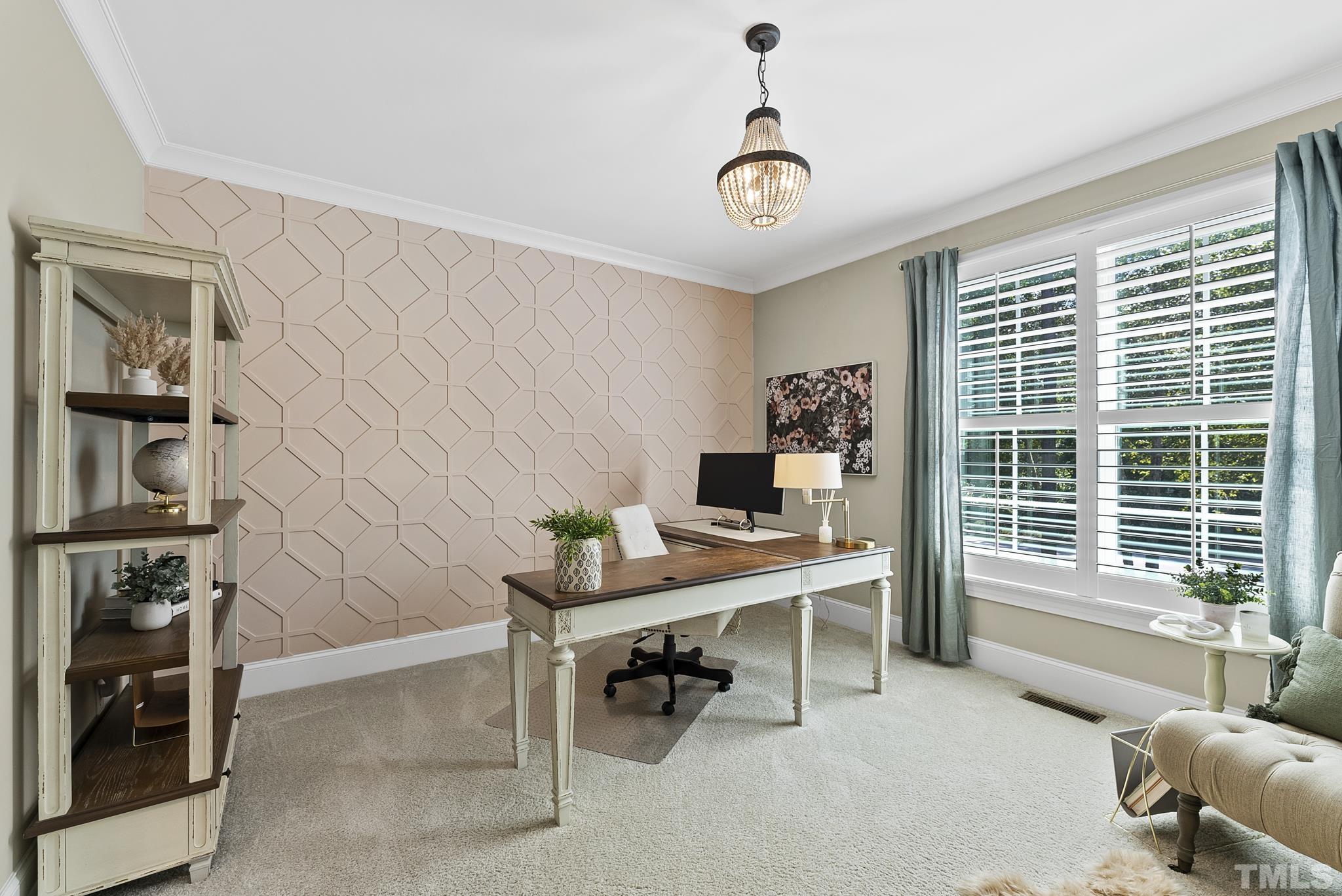 6121 Spring Branch Circle Raleigh, NC 27603 - Photo 20 of 60 a view of a workspace with furniture and a window