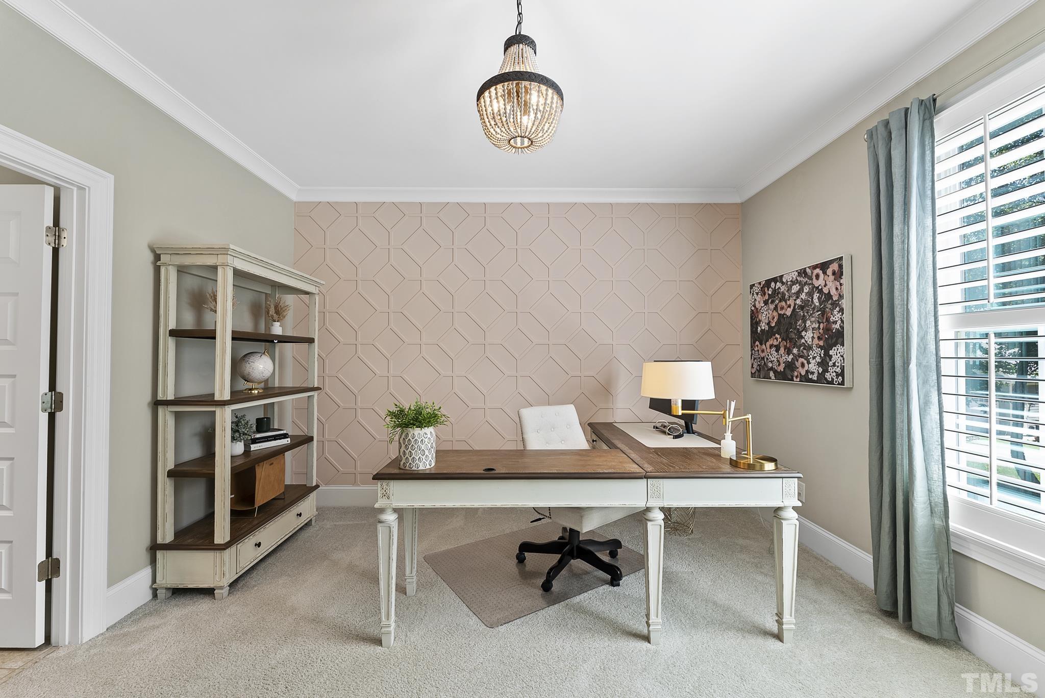 6121 Spring Branch Circle Raleigh, NC 27603 - Photo 21 of 60 a view of a workspace with furniture and a window