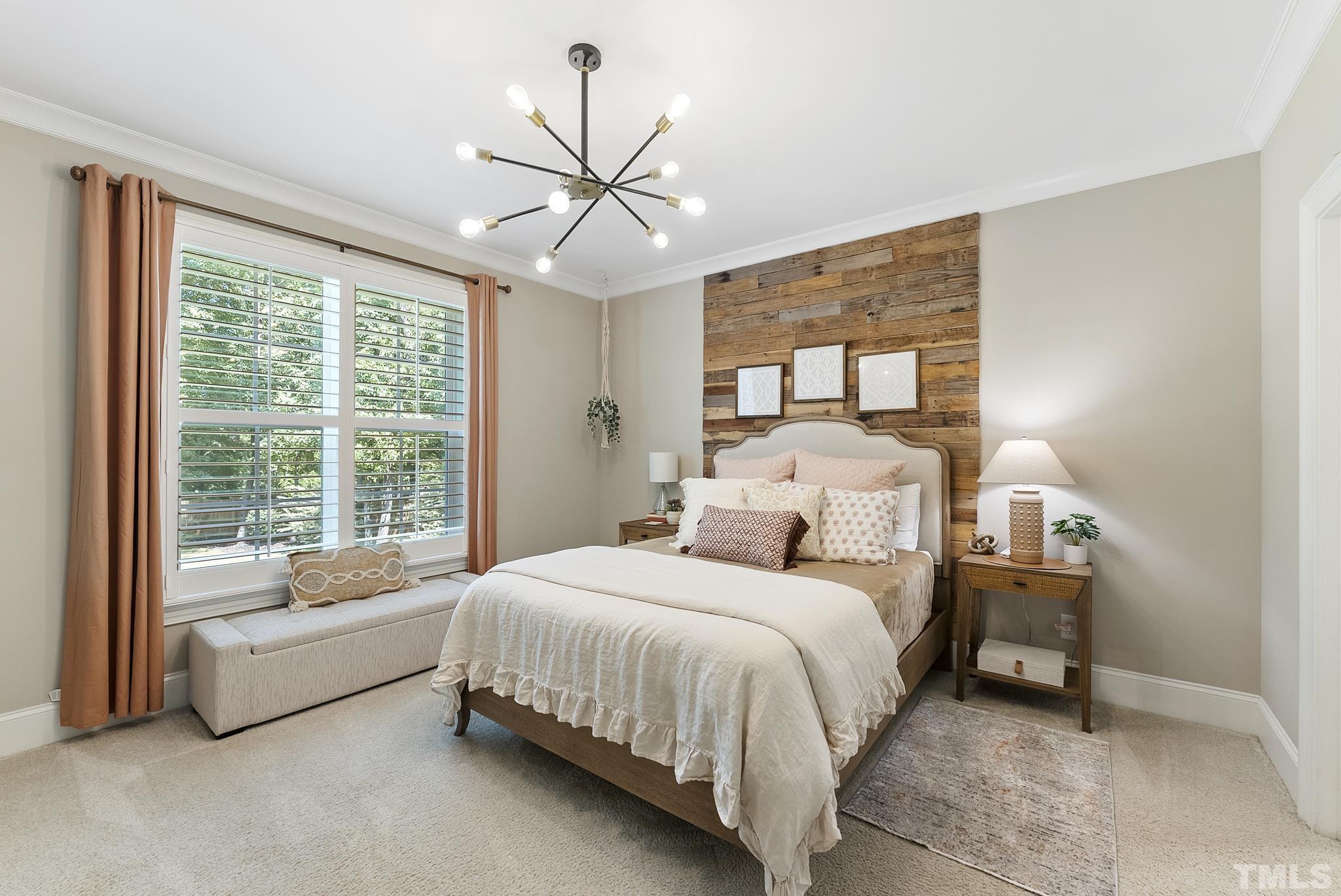 6121 Spring Branch Circle Raleigh, NC 27603 - Photo 23 of 60 a bedroom with a bed and a large window